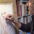 Fernando Vicente dibujando una pin up en su&nbsp;caballete